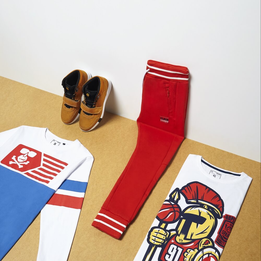 angle shot of of cropp clothing and accessories leaning against a wall