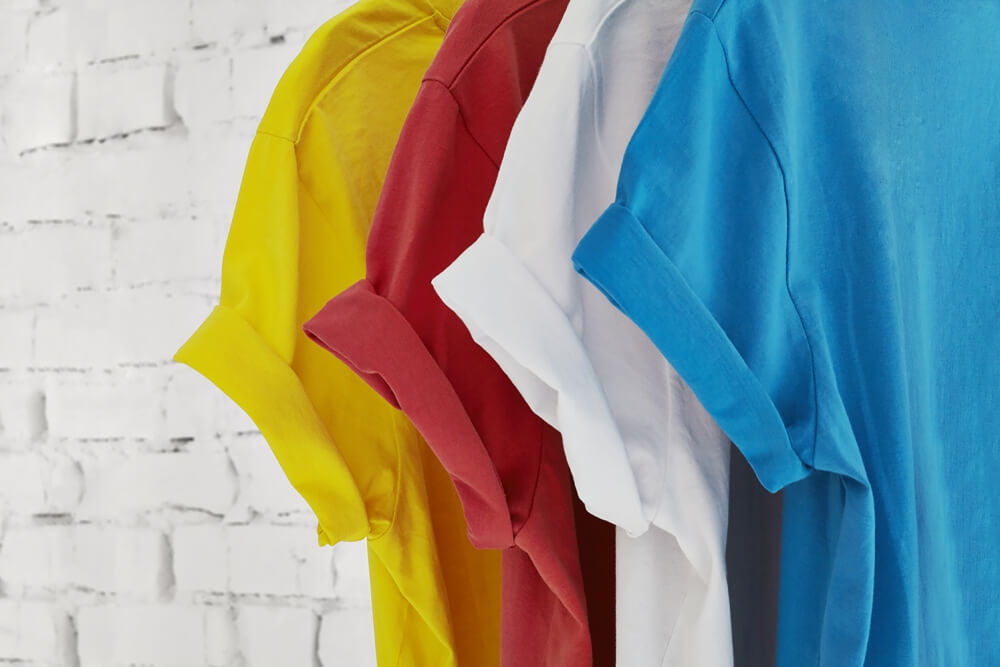 detail shot of various colors of sleeves of the same House brand top model