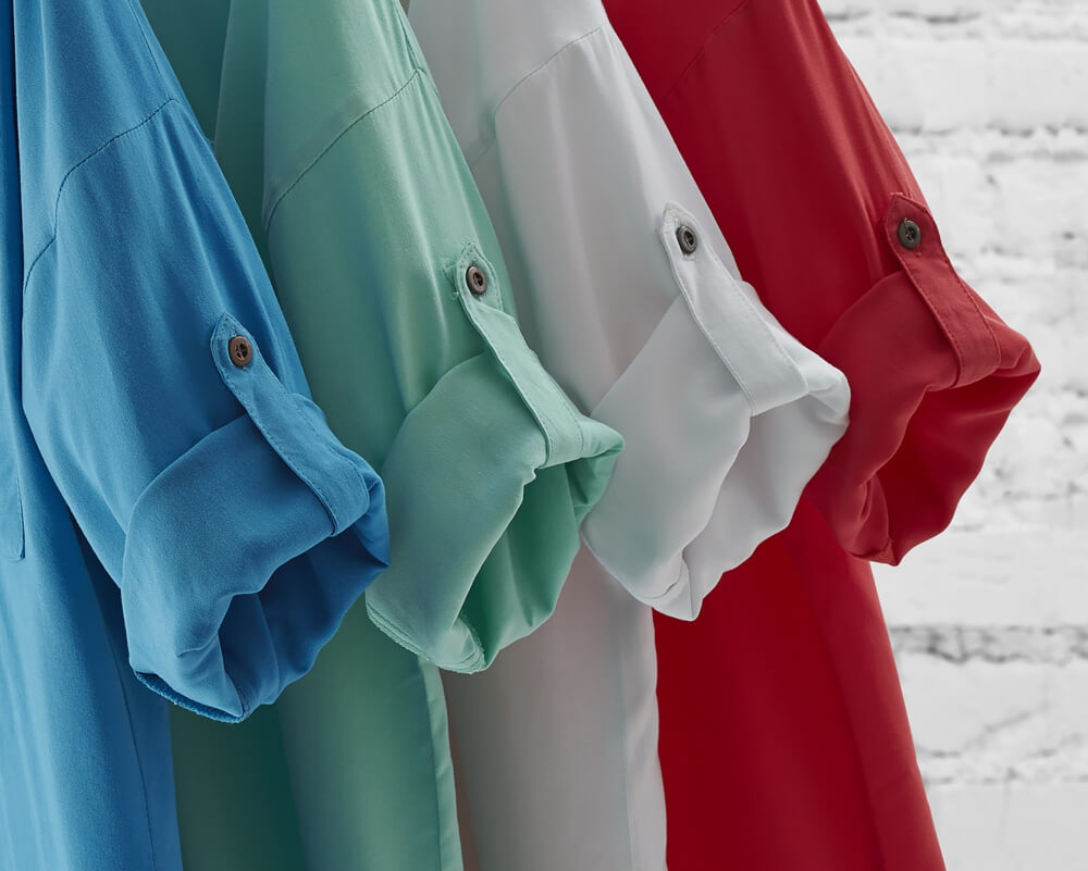 detail shot of sleeves of shirts in different color variations