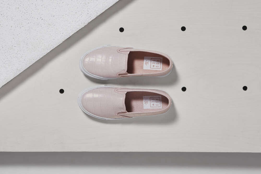 top shot photo of House brand footwear on a light single color background
