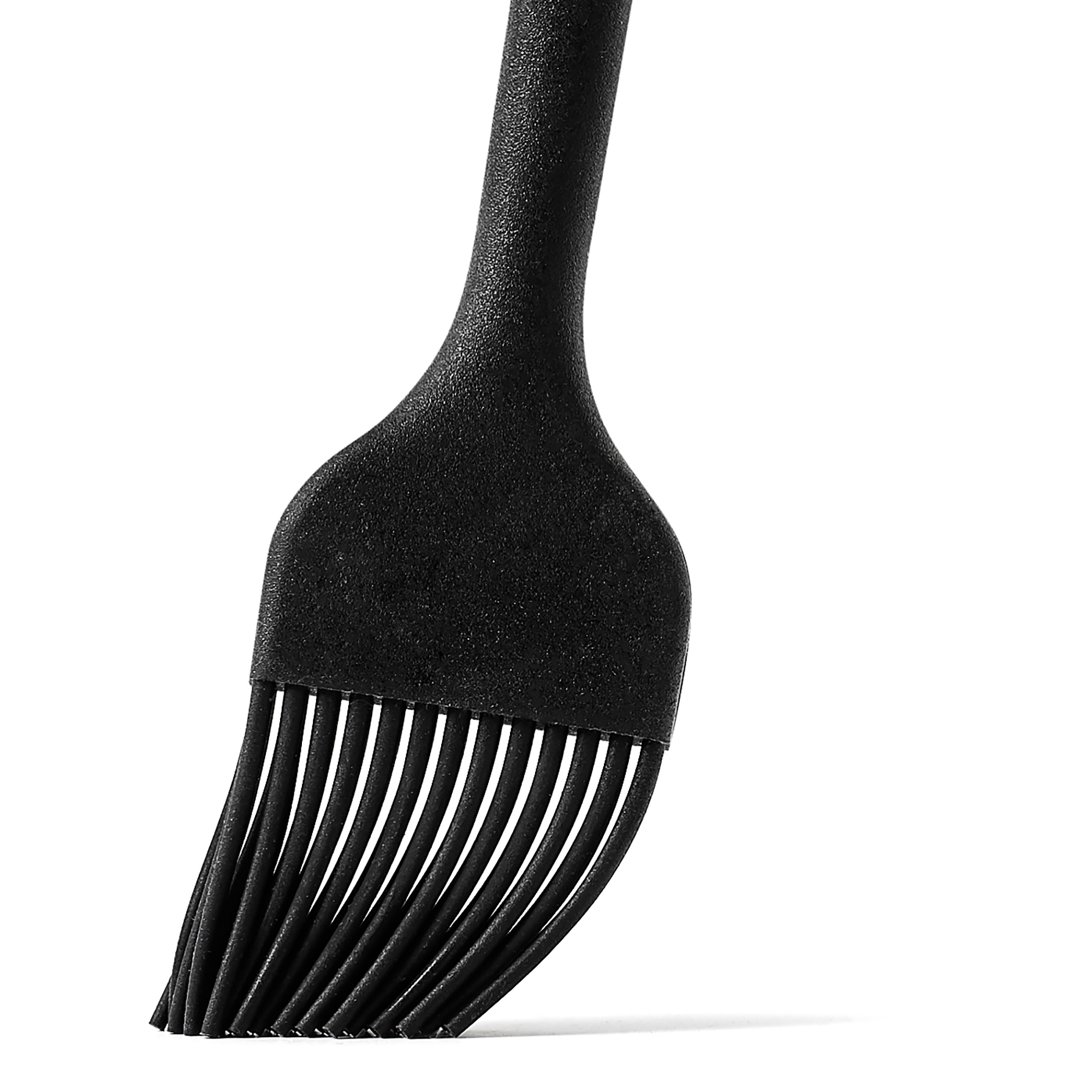 detail shot of silicone kitchen brush on a white background