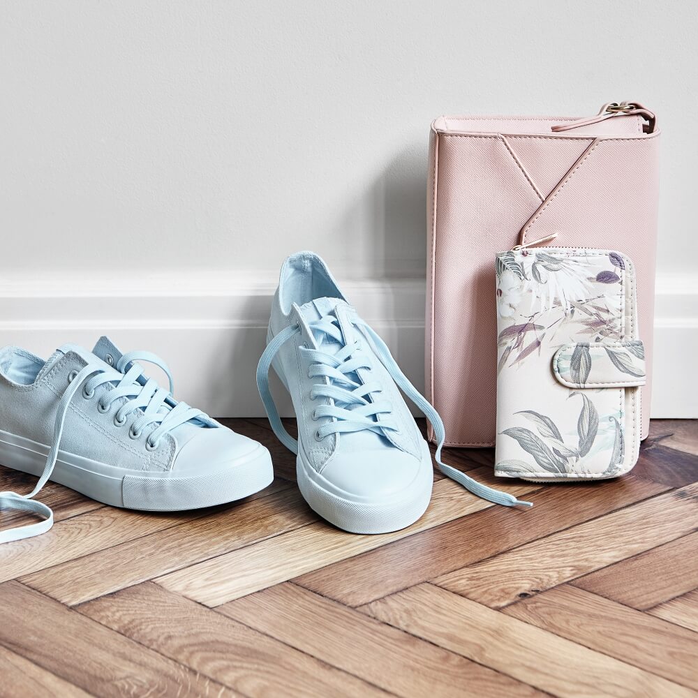 commercial photo of a pair of shoes, purse and a wallet from House brand