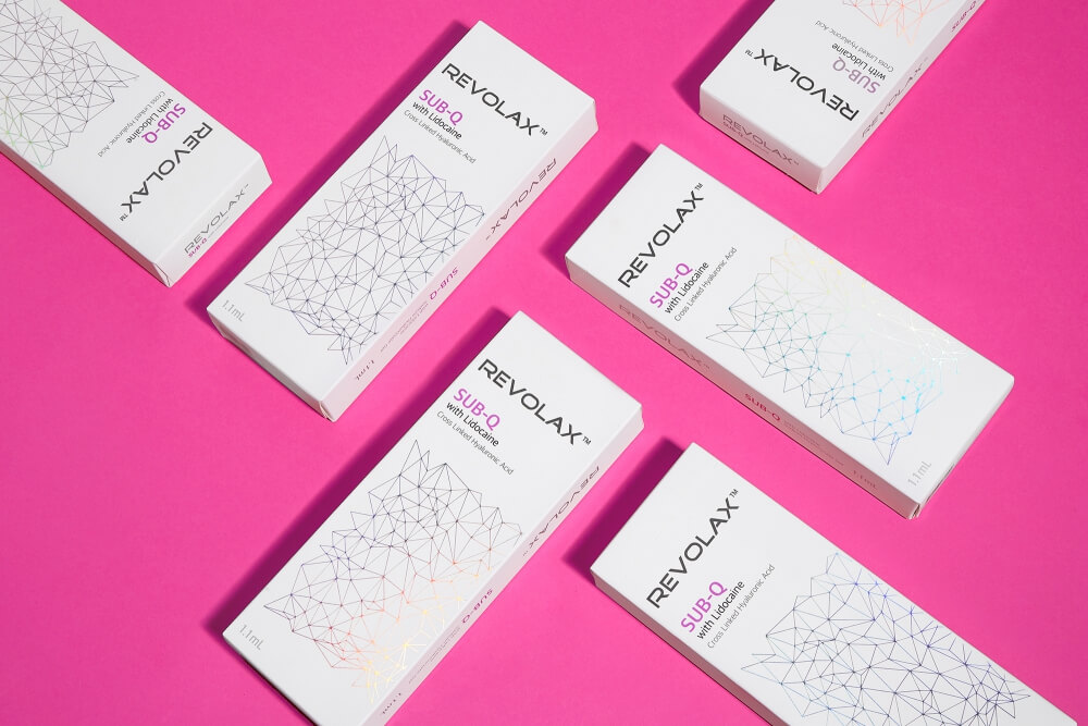 creative flat lay photo of ODA cosmetics packages on a pink background