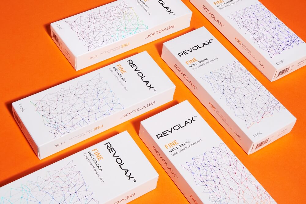 arrangement of ODA cosmetics on a orange background